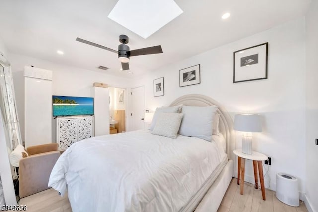 bedroom with recessed lighting, visible vents, light wood-style flooring, and a skylight