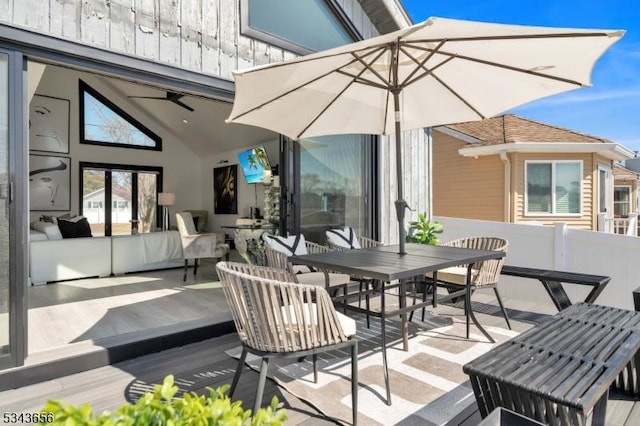 wooden terrace featuring outdoor dining space