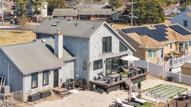 birds eye view of property with a residential view