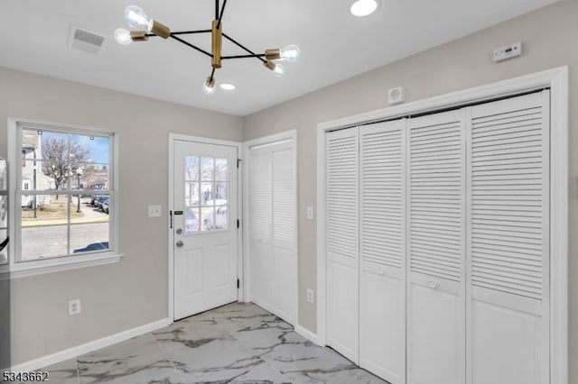 entrance foyer featuring recessed lighting, visible vents, baseboards, and marble finish floor