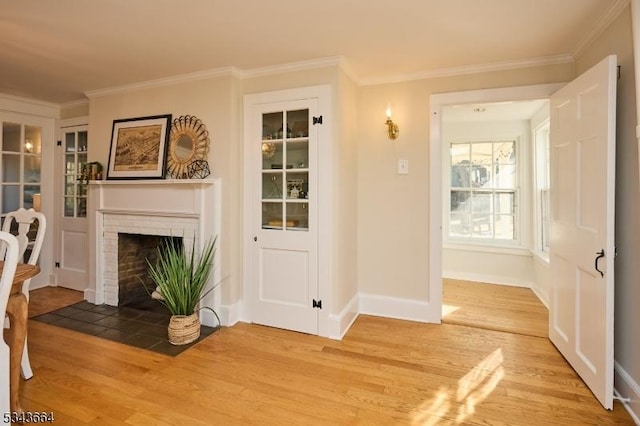 interior space featuring crown molding and light wood-style floors