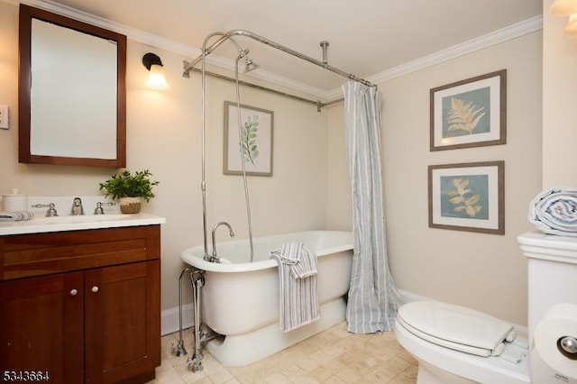 bathroom featuring vanity, toilet, crown molding, and a freestanding bath