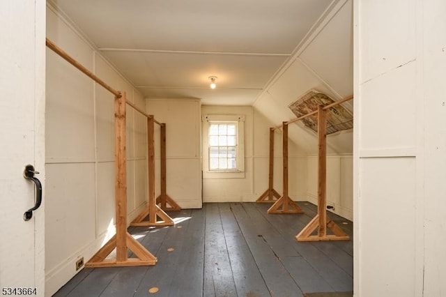 interior space featuring lofted ceiling and hardwood / wood-style flooring