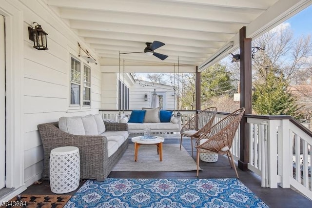 wooden terrace featuring an outdoor living space and ceiling fan