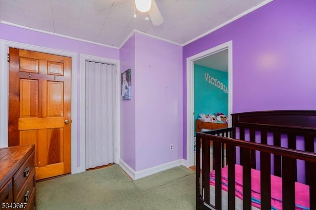 bedroom featuring carpet flooring, baseboards, a closet, and ceiling fan