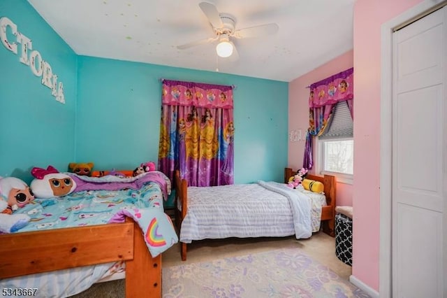 carpeted bedroom with a ceiling fan