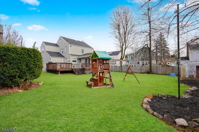 exterior space with a deck, fence, and a residential view