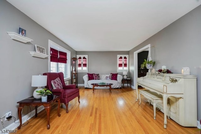 living room with light wood-style floors and baseboards