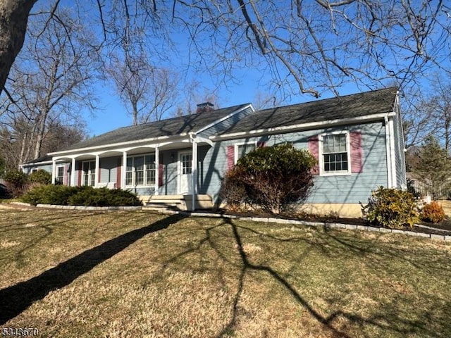 single story home featuring a front yard, a porch, and a chimney