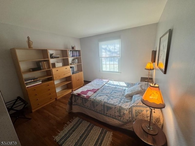 bedroom with wood finished floors