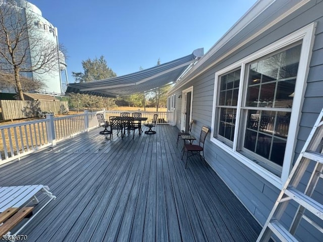 deck with outdoor dining area