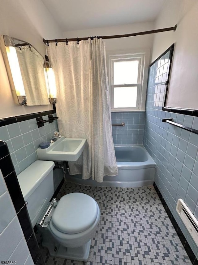 131 Beverly Rd, Bloomfield Twp, NJ 07003 - bathroom with a baseboard radiator, tile walls, toilet, tile patterned floors, and shower / bath combo with shower curtain