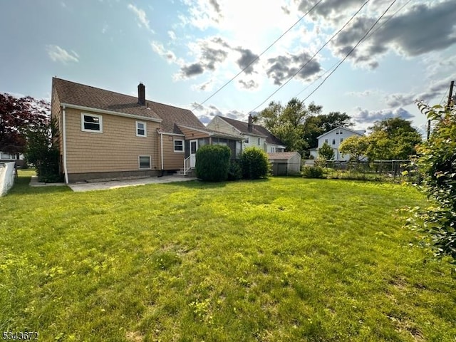 131 Beverly Rd, Bloomfield Twp, NJ 07003 - back of house featuring a chimney and entry steps