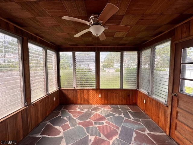 131 Beverly Rd, Bloomfield Twp, NJ 07003 - unfurnished sunroom with wooden walls, plenty of natural light, and stone floors
