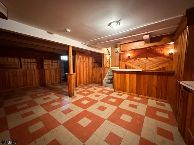 131 Beverly Rd, Bloomfield Twp, NJ 07003 - finished basement with wood walls, tile patterned floors, and stairs
