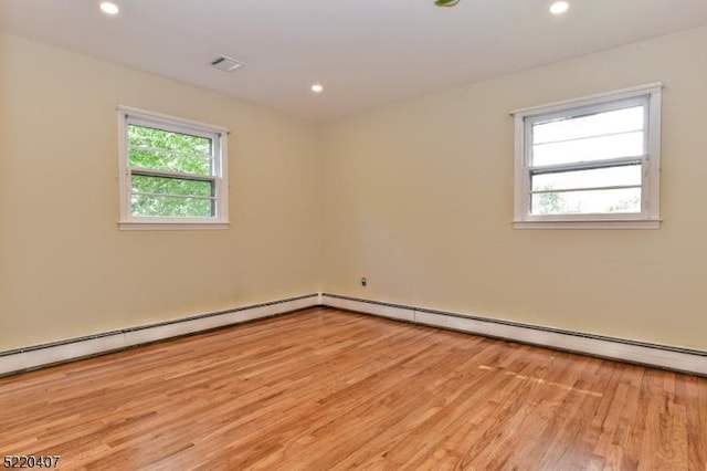 spare room featuring recessed lighting, visible vents, and light wood finished floors