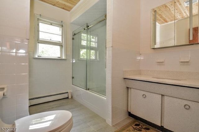 bathroom featuring a baseboard heating unit, toilet, tile walls, and vanity