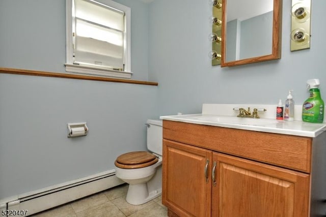 bathroom with vanity, baseboard heating, toilet, and tile patterned flooring