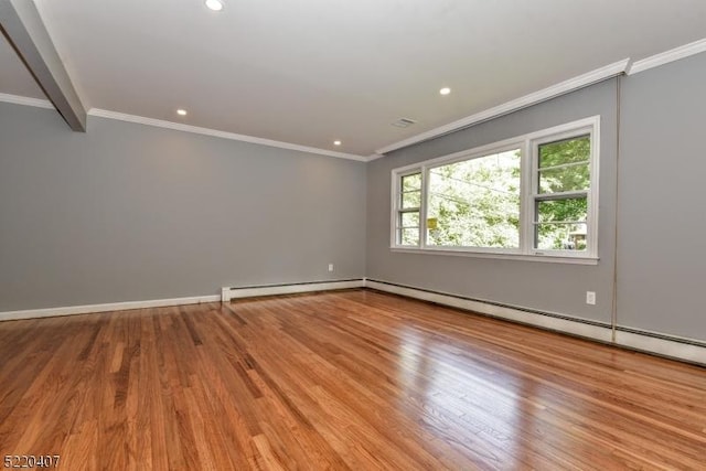 spare room featuring a baseboard heating unit, crown molding, recessed lighting, and wood finished floors