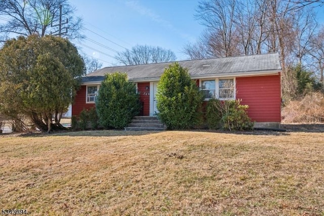 single story home featuring a front yard