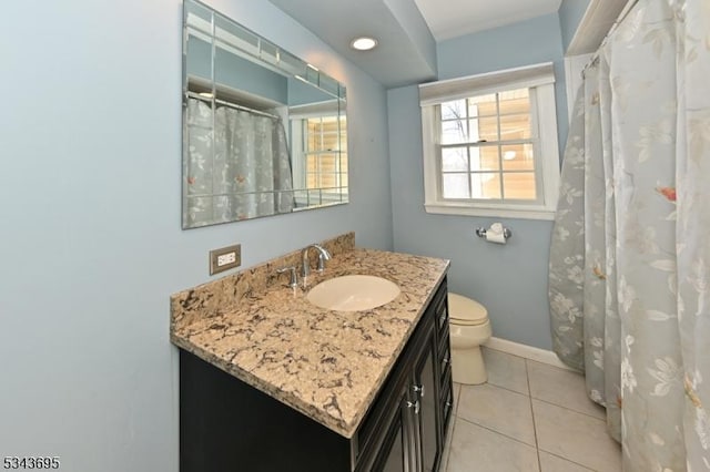 bathroom with tile patterned floors, baseboards, toilet, and vanity