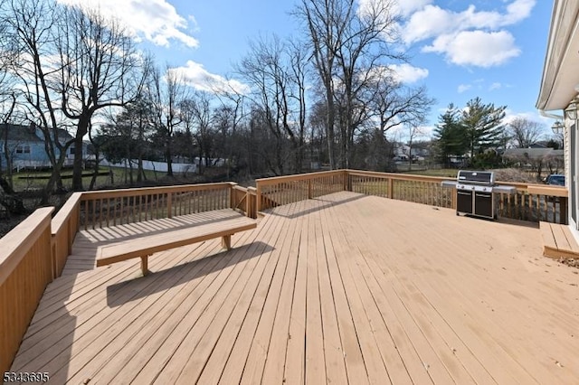 deck featuring a grill