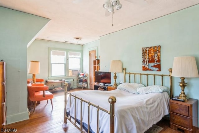 bedroom featuring wood finished floors