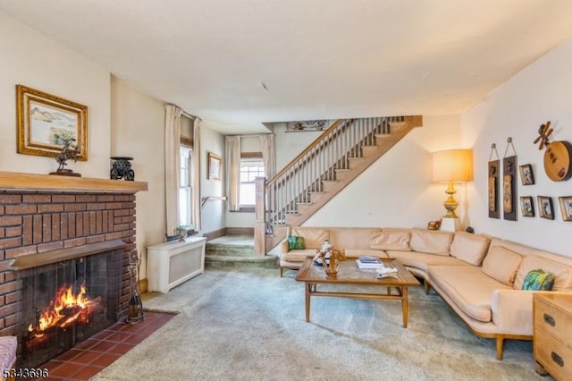 living area featuring stairway, a fireplace, and carpet floors