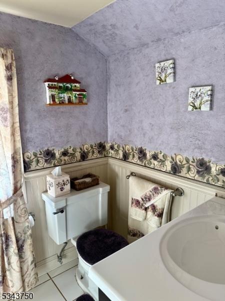 bathroom with a sink and tile patterned floors