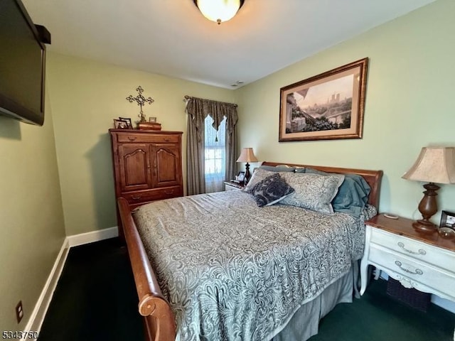 bedroom featuring baseboards