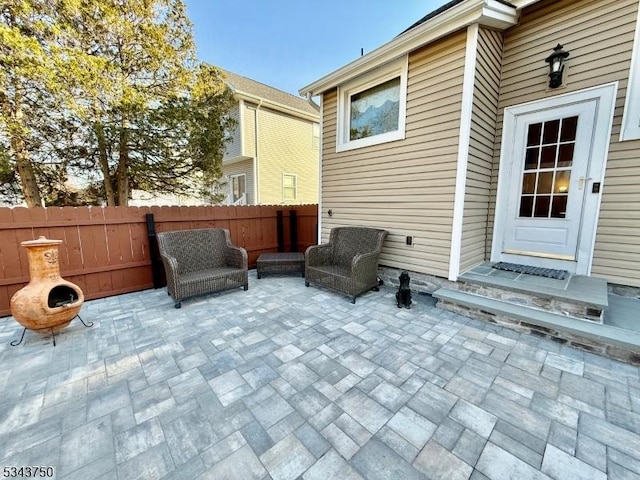 view of patio / terrace featuring fence