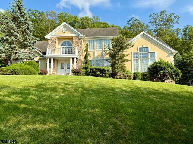 20 Tonnelier Way, Denville Twp, NJ 07834 - view of front of house with a front lawn, stucco siding, a balcony, and stone siding