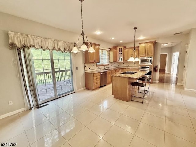 20 Tonnelier Way, Denville Twp, NJ 07834 - kitchen with appliances with stainless steel finishes, light tile patterned floors, a breakfast bar, backsplash, and recessed lighting