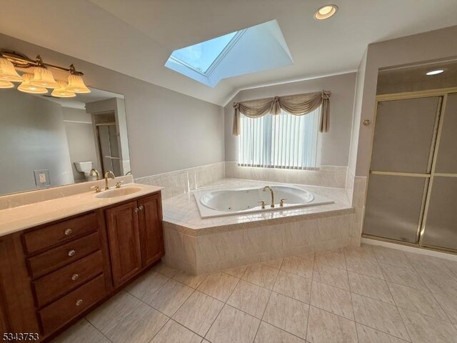 20 Tonnelier Way, Denville Twp, NJ 07834 - bathroom featuring a skylight, a whirlpool tub, vanity, tile patterned flooring, and a stall shower