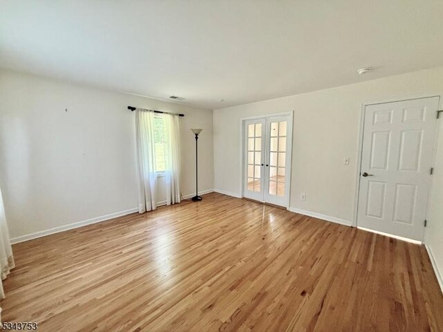 20 Tonnelier Way, Denville Twp, NJ 07834 - unfurnished room with french doors and light wood-style flooring