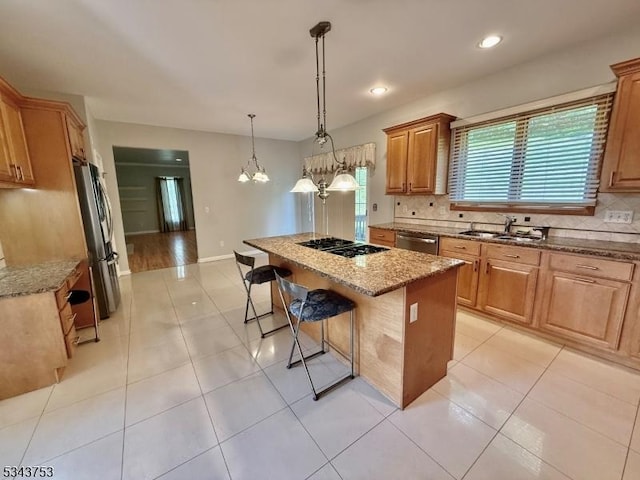20 Tonnelier Way, Denville Twp, NJ 07834 - kitchen with appliances with stainless steel finishes, a kitchen bar, light stone countertops, backsplash, and recessed lighting