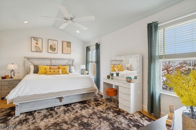 bedroom featuring baseboards, a ceiling fan, and vaulted ceiling