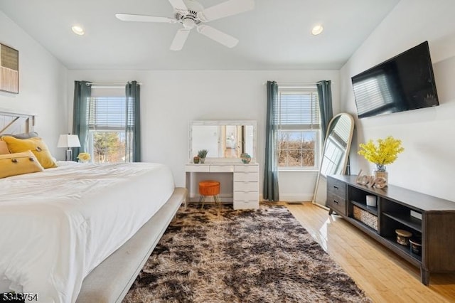 bedroom featuring recessed lighting, light wood-type flooring, a ceiling fan, and lofted ceiling