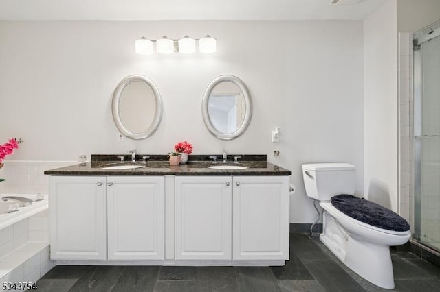 bathroom featuring a sink, toilet, and tile patterned floors