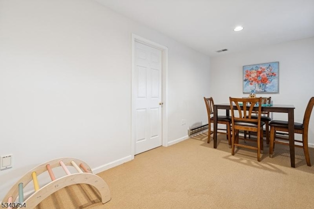 dining room with recessed lighting, visible vents, baseboards, and light carpet