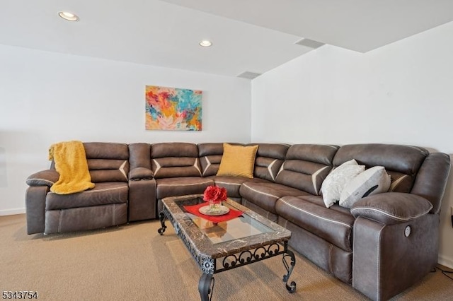 living area featuring recessed lighting and light colored carpet