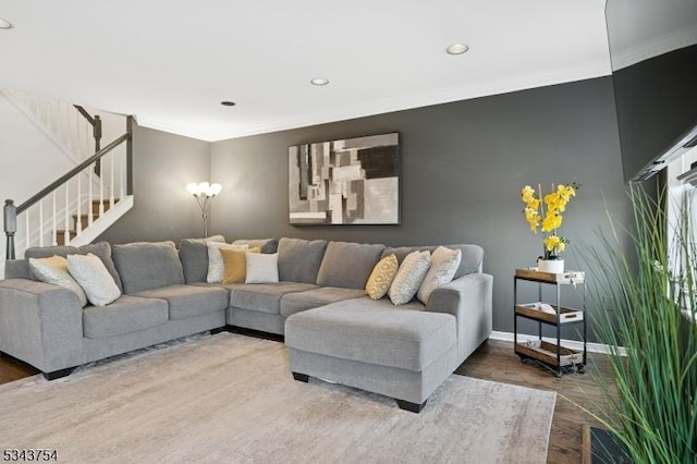 living room with wood finished floors, recessed lighting, crown molding, baseboards, and stairs