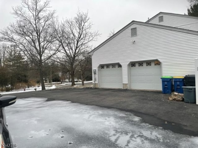 garage with aphalt driveway