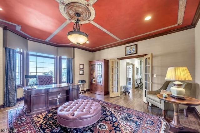 home office featuring french doors, baseboards, wood finished floors, and crown molding