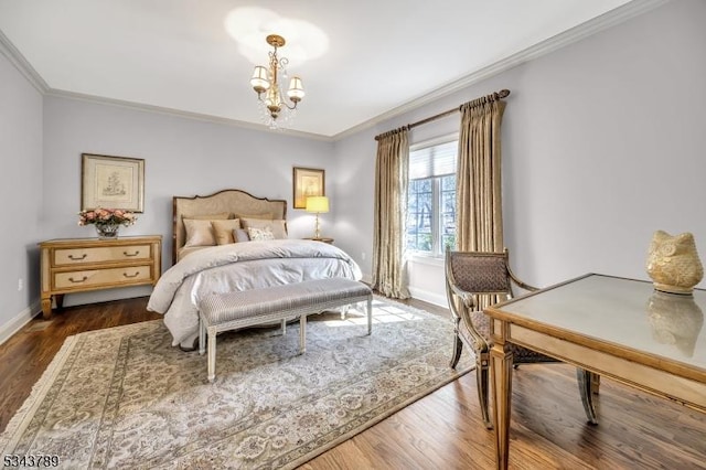 bedroom featuring an inviting chandelier, crown molding, wood finished floors, and baseboards