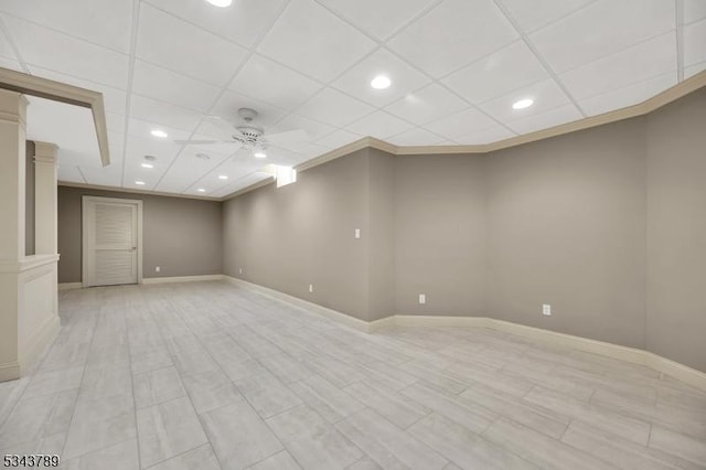 basement with a paneled ceiling, recessed lighting, baseboards, and ceiling fan