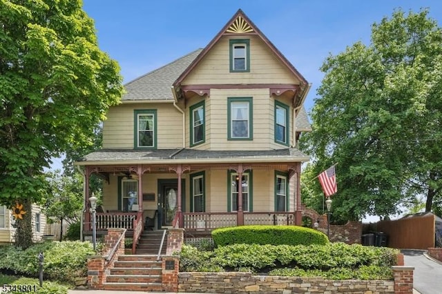 7 High St, Stanhope Boro, NJ 07874 - victorian house featuring a porch, a shingled roof, and stairs