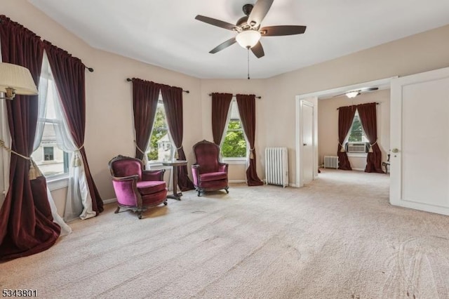 7 High St, Stanhope Boro, NJ 07874 - living area featuring radiator heating unit, ceiling fan, cooling unit, and carpet flooring