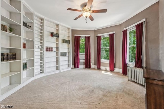 7 High St, Stanhope Boro, NJ 07874 - carpeted empty room featuring radiator heating unit, ceiling fan, crown molding, baseboards, and built in shelves