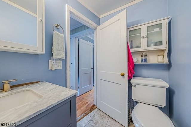 bathroom featuring toilet and vanity